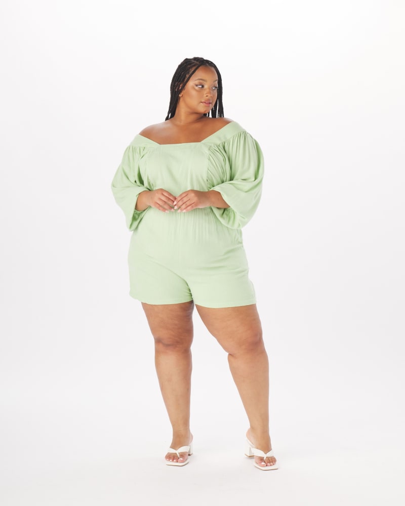 Front of a model wearing a size 3X Anna Peasant Romper in Periwinkle in Mint by What Lo Wants. | dia_product_style_image_id:237978
